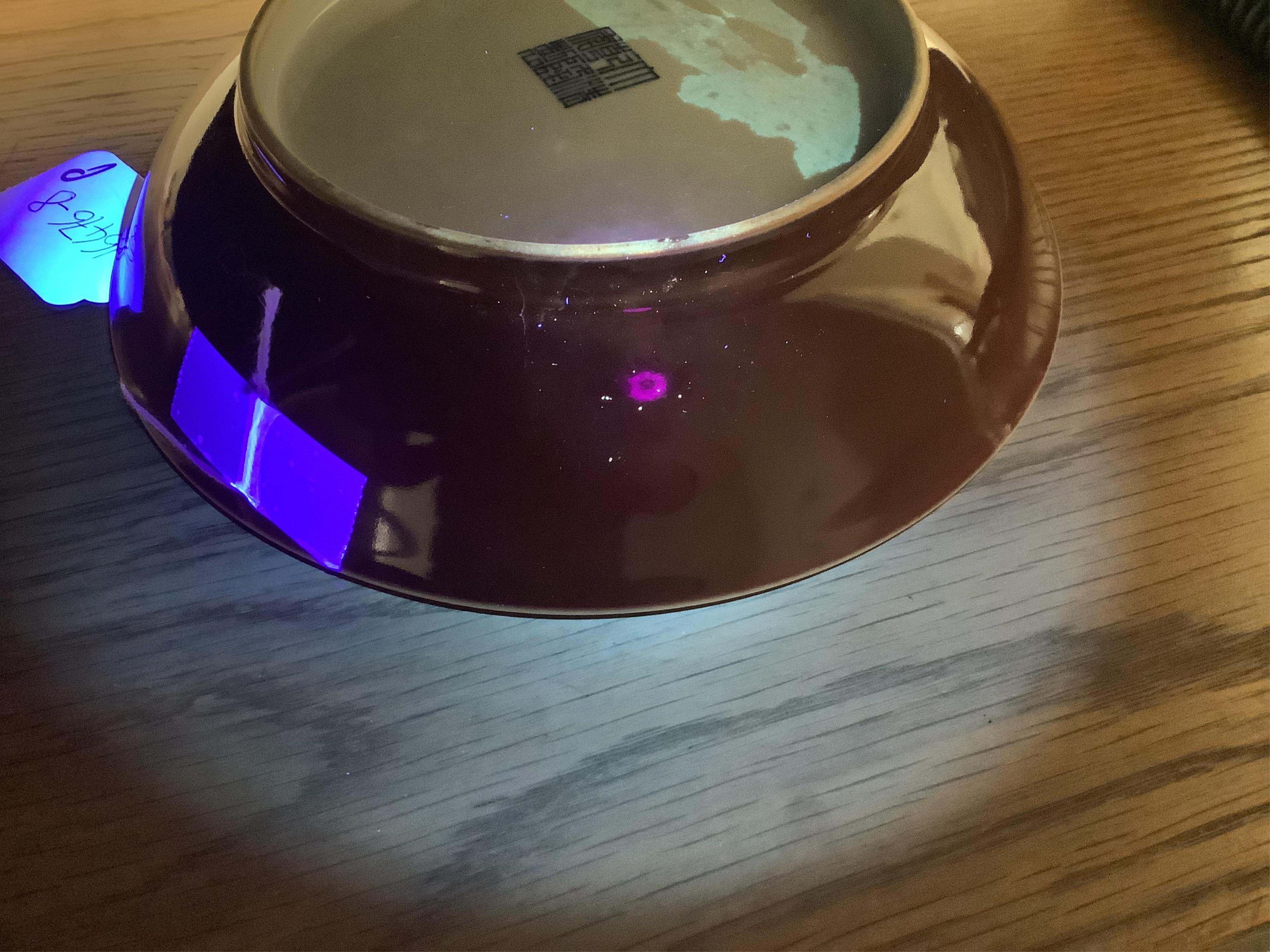 A Chinese copper-red glazed saucer dish, Qianlong six-character seal mark and of the period (1736-95)